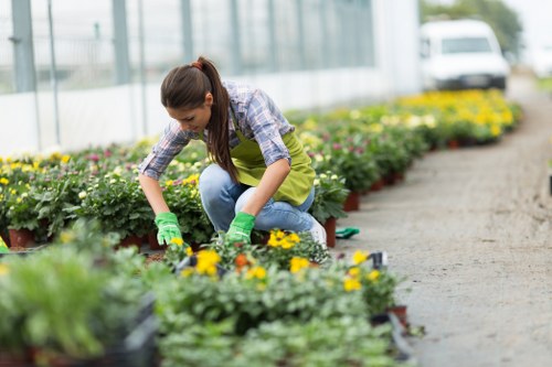 Gardener preparing tools and PPE at start of work